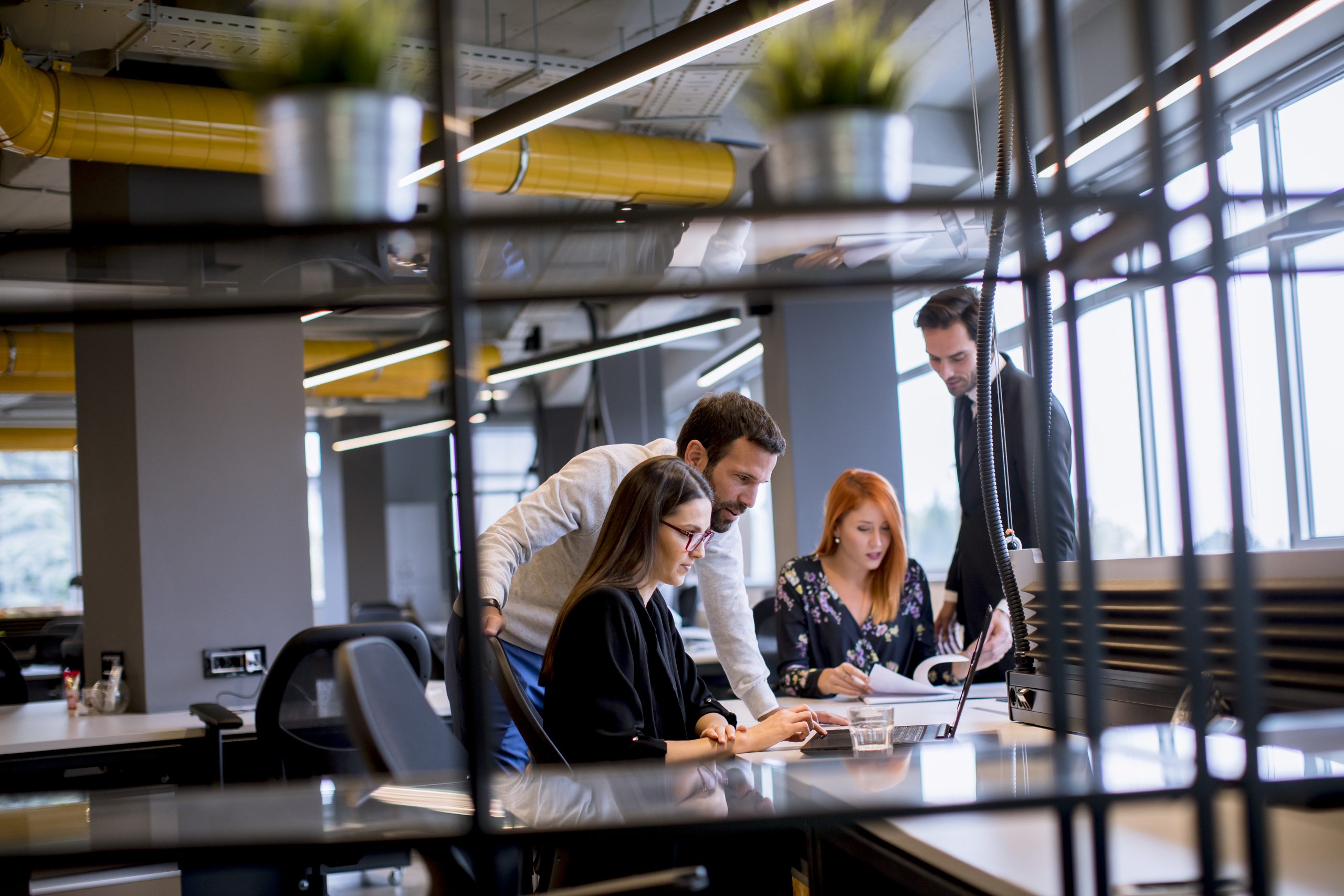 Group of young business people are working together with desktop